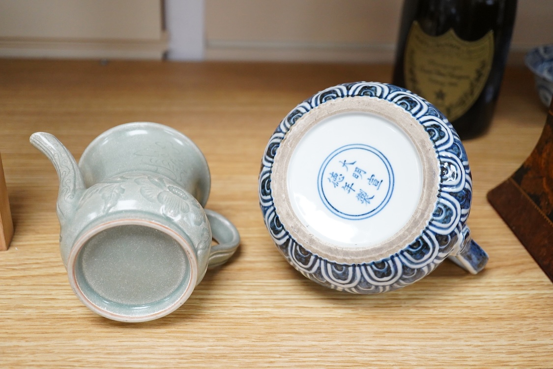 A Chinese blue and white teapot and cover, Xuande mark but later and a Chinese celadon glazed jug, tallest 13.5cm